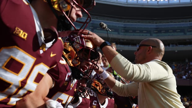 P.J. Fleck and Gophers players